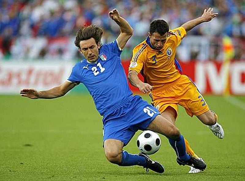 Euro 2008 (10).jpg - Italy's Andrea Pirlo, left, and Romania's Razvan Rat challenge for the ball during the group C match between Italy and Romania in Zurich, Switzerland, Friday, June 13, 2008, at the Euro 2008 European Soccer Championships in Austria and Switzerland.